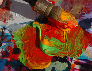 Brush Loaded with Swirling Paint