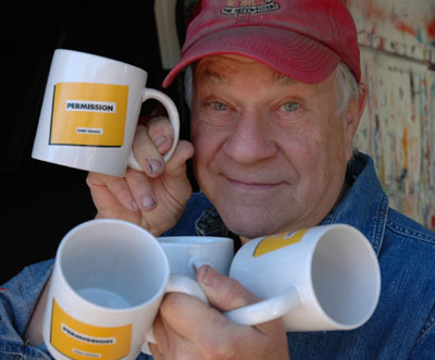 Bob holding Permission Mugs